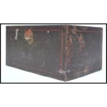 An early century heavy cast iron strong box, panelled sides, brass drop swag carry handles to