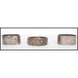 A group of three silver bangles to include a pair of 19th century hallmarked silver Victorian