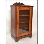 A Victorian mahogany and marquetry inlaid pier cabinet. Raised on plinth base with single door