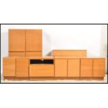 A selection of retro teak wood modular sectional Tapley wall and floor units / cabinets, the units