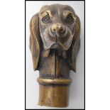 An early 20th century bronze walking stick handle in the form of a hunting setter dog.