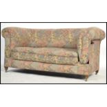 A Victorian mahogany tapestry upholstered drop arm