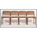 A set of 4 retro 20th century Danish influenced teak wood dining chairs, Raised on squared legs with