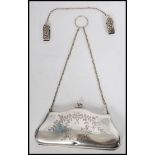A vintage early 20th century silver plated ladies purse with fitted sectional green velour