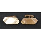 A pair of hallmarked 9ct gold of larger form of oblong shape having engraved decoration. Weighs 11.2