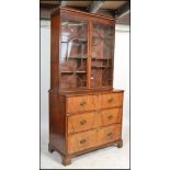 A Georgian 18th / 19th century mahogany secretaire bureau bookcase on chest. Raised on bracket