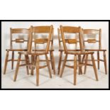 A set of 6 antique style oxford bar back windsor dining chairs raised on turned legs with panel
