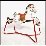 A vintage 1960's retro tin pressed metal MOBO rocking horse. Original labels with good colours