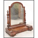 A 19th century mahogany dressing table swing mirror in the manner of Gillows. Raised on a shaped