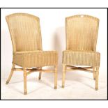 A pair of 20th century Lloyd loom style rattan weave conservatory chairs each raised on turned