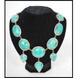 A silver 925 large turquoise adorned choker necklace of art nouveau style set to a hoop link chain