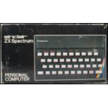 A boxed retro 1980s ZX Spectrum by Sinclair retaining the original box