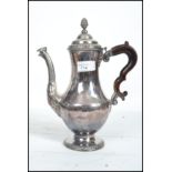 An 18th century George III silver plated coffee pot in the manner of Hester Bateman. Baluster form