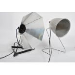 A non matching pair of vintage up cycled 20th century photographic lamps, both being converted