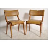 A pair of 2 mid century Ben Chairs ( benchairs ) raised on angular bentwood frames with  green