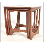 A 1970's G-Plan ' Astro ' teak wood nest of tables. The tables of graduating form with each being