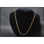 An 18ct gold curb link necklace chain having a bolt ring clasp. Measures 20 inches long weighs 11