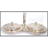 A vintage 20th century silver plated twin handled muffin warmer centre piece. Each with round tureen