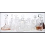 A good collection of vintage early and later 20th century cut glass lead decanters to include a