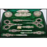 A Victorian silver hallmarked Art Nouveau ladies necessaire vanity manicure set by Levi & Salaman.