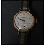 A vintage 20th century hallmarked 9ct gold wrist watch by Precista. The silvered dial having an