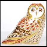 A Royal Crown Derby paperweight, Short Eared Owl gold stopper, red stamp to base dated mark for 2008