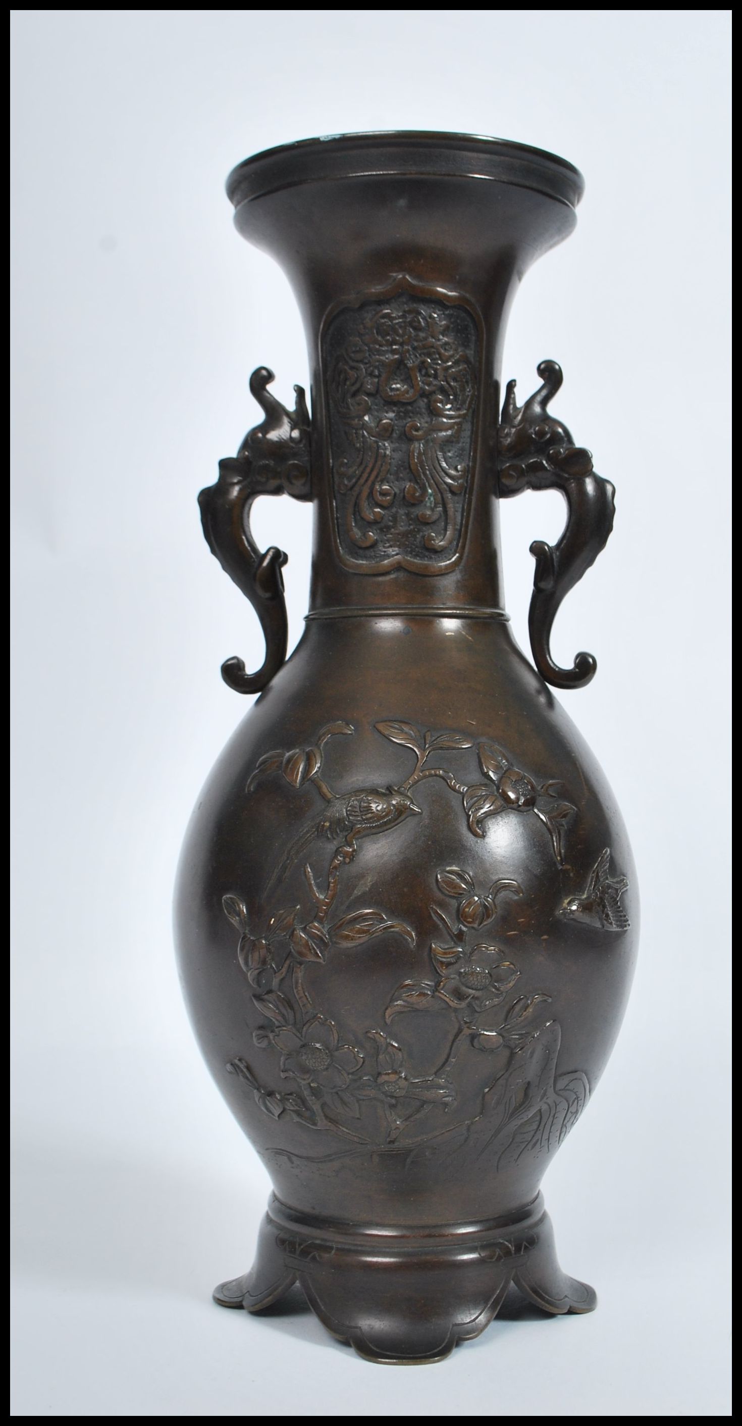 A Meji period Japanese bronze two handled vase of typical baluster form, decorated in relief with - Image 3 of 6