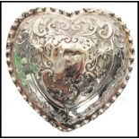 A silver Edwardian hallmarked Rococo heart shaped trinket pot with fitted  hinged lid. Birmingham