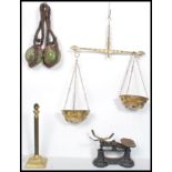 A set of vintage 20th century brass balance scales together with a pair of fishermans glass buoys