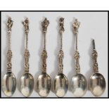A set of 6 silver  hallmarked apostle tea spoons by Charles Stuart Harris, London 1884. One af.
