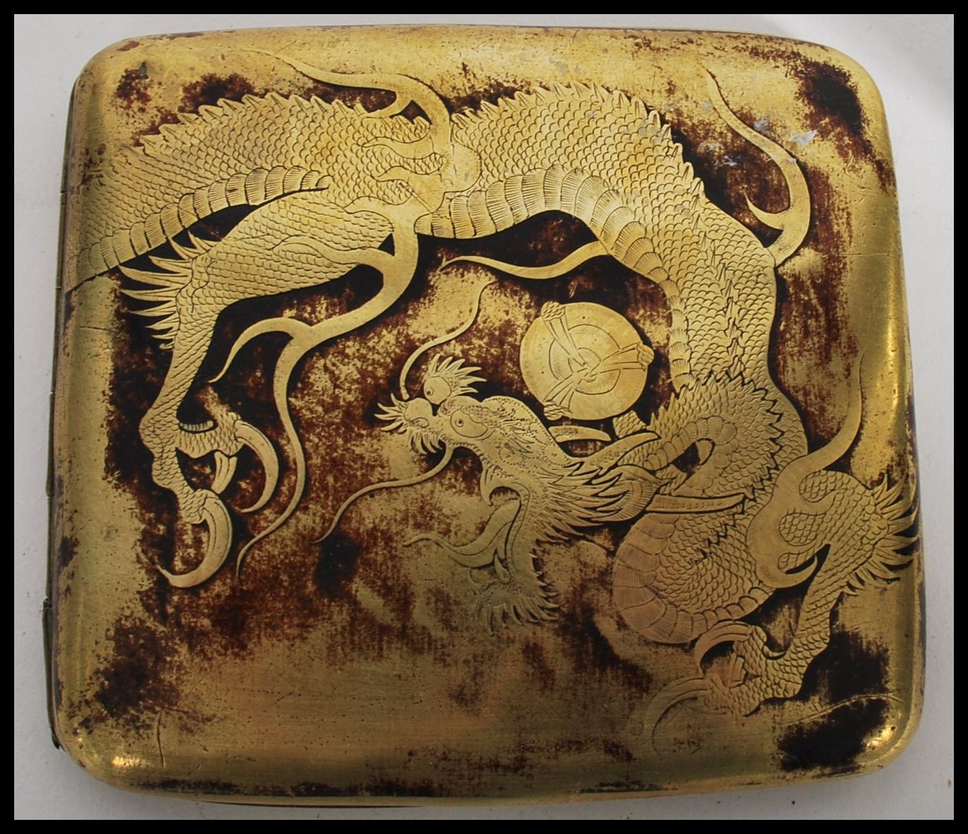A vintage 20th century Chinese brass cigarette case depicting a dragon along with a silver white - Image 2 of 7