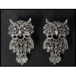 A pair of 925 silver earrings in the form of owls set with marcasite having post backs. Marked