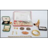 A collection of vintage jewellery to include copper leaf brooch, pearl necklaces, 9ct gold and