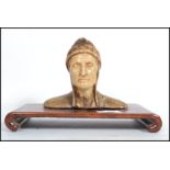 A vintage 20th century moulded figure bust modelled as  Dante raised on a shaped plinth base. Repair