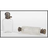 A silver and cut glass double ended perfume phial along with another silver topped perfume scent