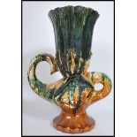 An unusual mid century retro Fat Lava style twin handled abstract majolica vase. Dripglaze colourway
