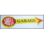 A vintage style painted cast iron advertising point of sale garage sign for Shell in the form of