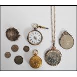 A continental silver 800 pocket watch along with a gold tone metal sovereign holder a Victorian 1887
