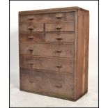 A vintage 20th century workmans / engineers oak  bank of drawers comprising of a series of short and