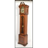 A 20th century mahogany Tempus Fugit longcase clock with silvered dial marked for ECS Westminster