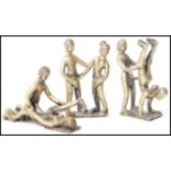 A group of three vintage 20th century Indian Kamasutra cast brass figurines of couples in various