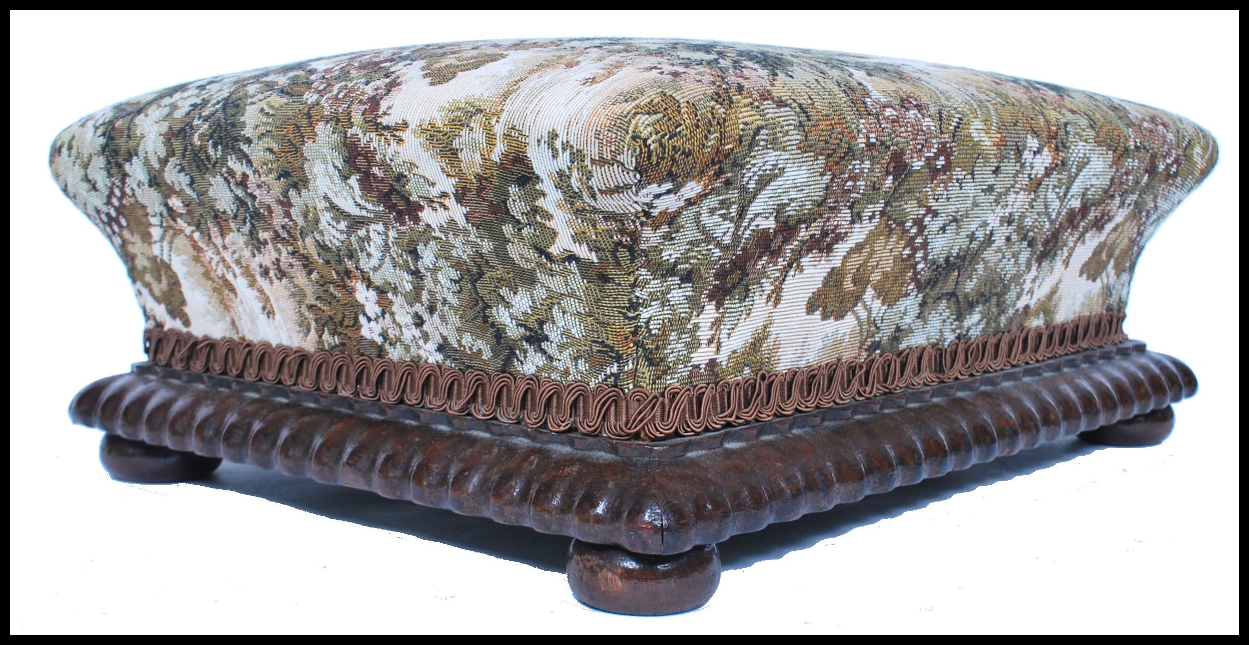 A  Victorian mahogany and tapestry upholstered footstool of square form raised on pad feet with