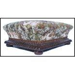 A  Victorian mahogany and tapestry upholstered footstool of square form raised on pad feet with