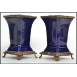 A pair of 19th century ceramic vases of square form having a deep cobalt blue ground with gilt