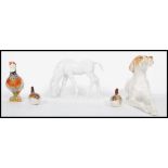 A collection of ceramic figurines to include a pair of Lomonosov / USSR Wrens, a large hound and a