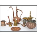 A good collection of 19th and 20th century Middle Eastern brass, copper and bronze items to