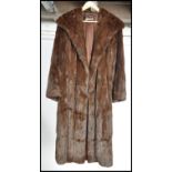 A vintage mid 20th century ladies dark mink coat, retailed by Harrods The three quarter length
