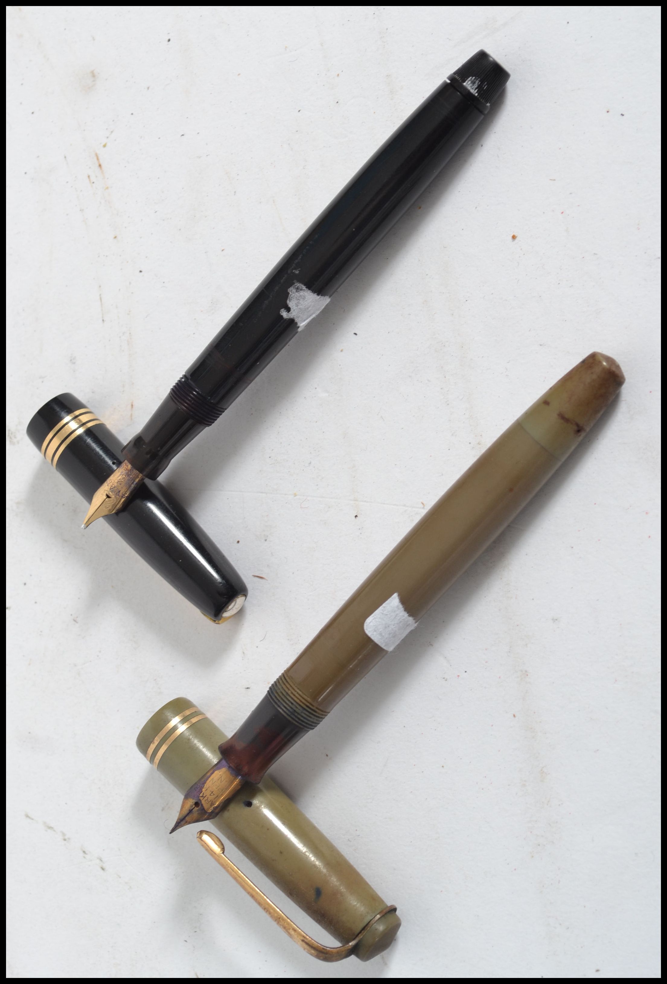 Two vintage 20th century fountain pens. One being a Parker pen with a 14ct gold nib and Swan pen