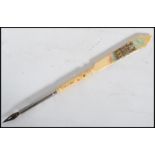 A 19th century Victorian Stanhope ivory pen and letter opener with painted pictorial and notation of