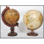 A vintage 20th century antique style globe by Replogle raised on a circular wooden base along with